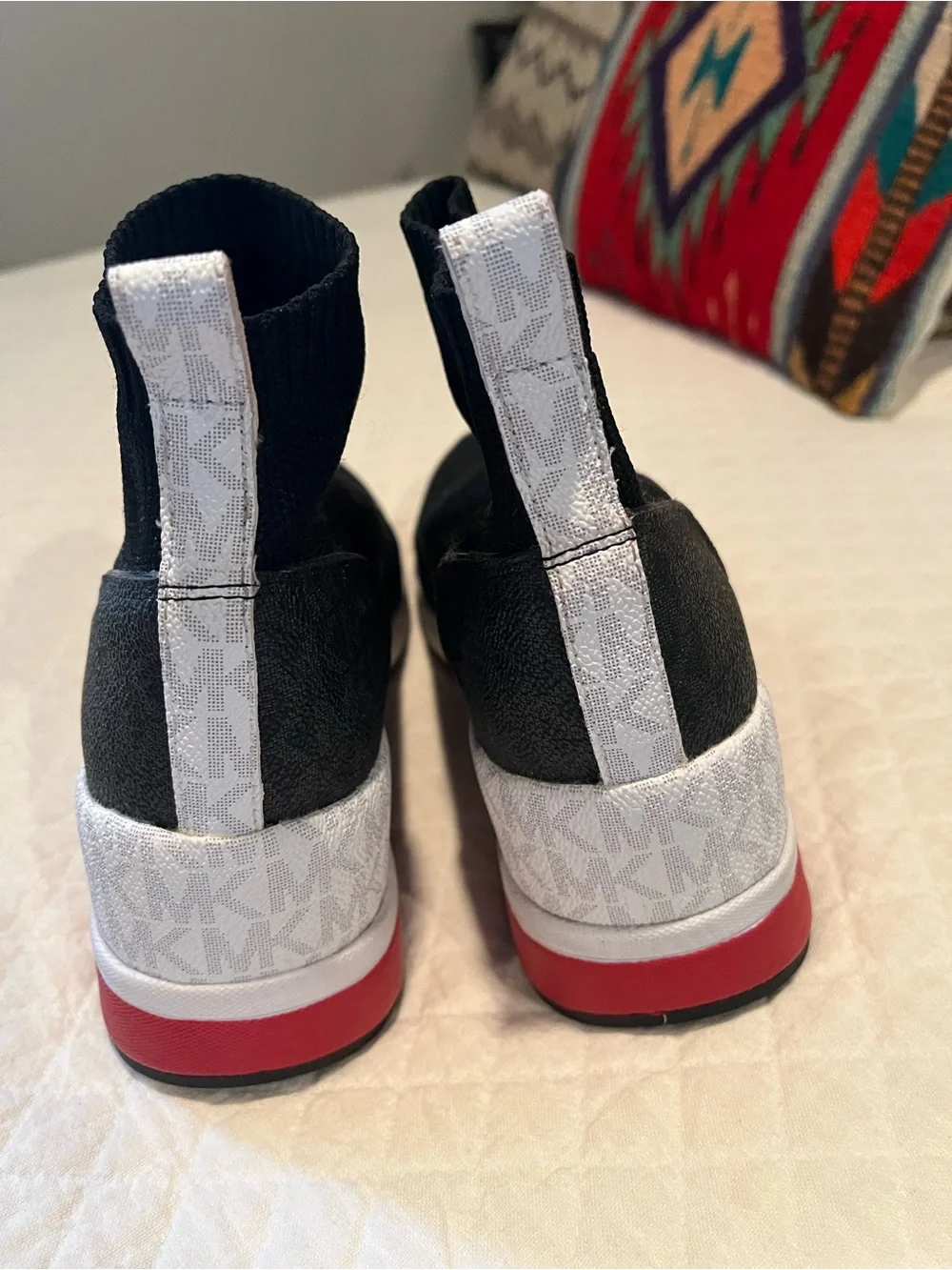 Michael Kors Black Slip-On Knit Sneakers with White and Red Accents